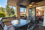 The private upstairs deck off the master bedroom is beautifully furnished with views